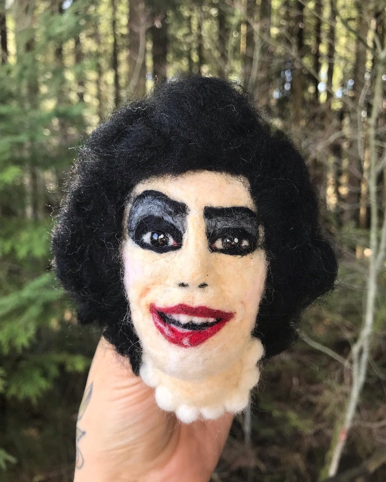 A needle felted portrait magnet of Frank-n-Furter from Rocky Horror Picture Show