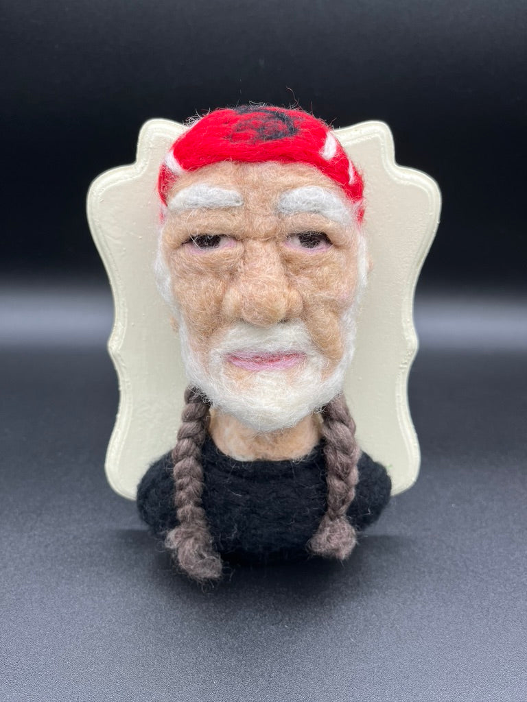 A custom needle felted portrait of Willie Nelson