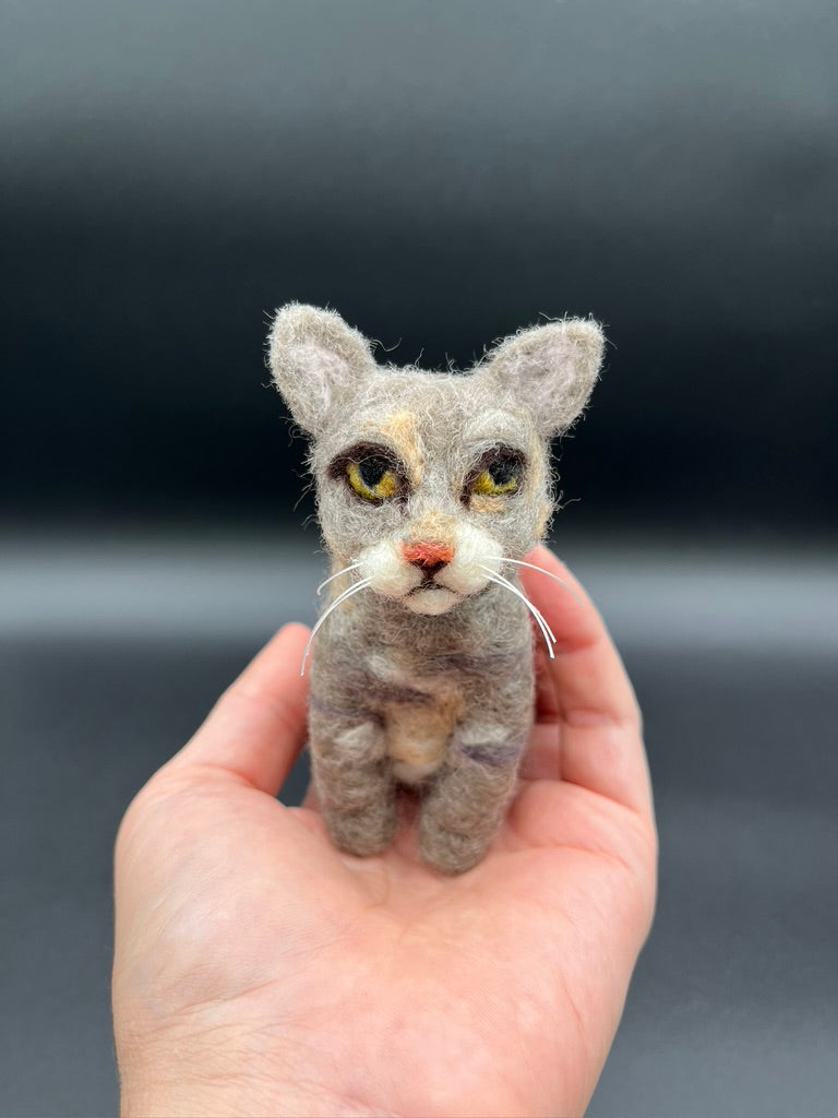 A needle felted pet portrait of a kitty cat