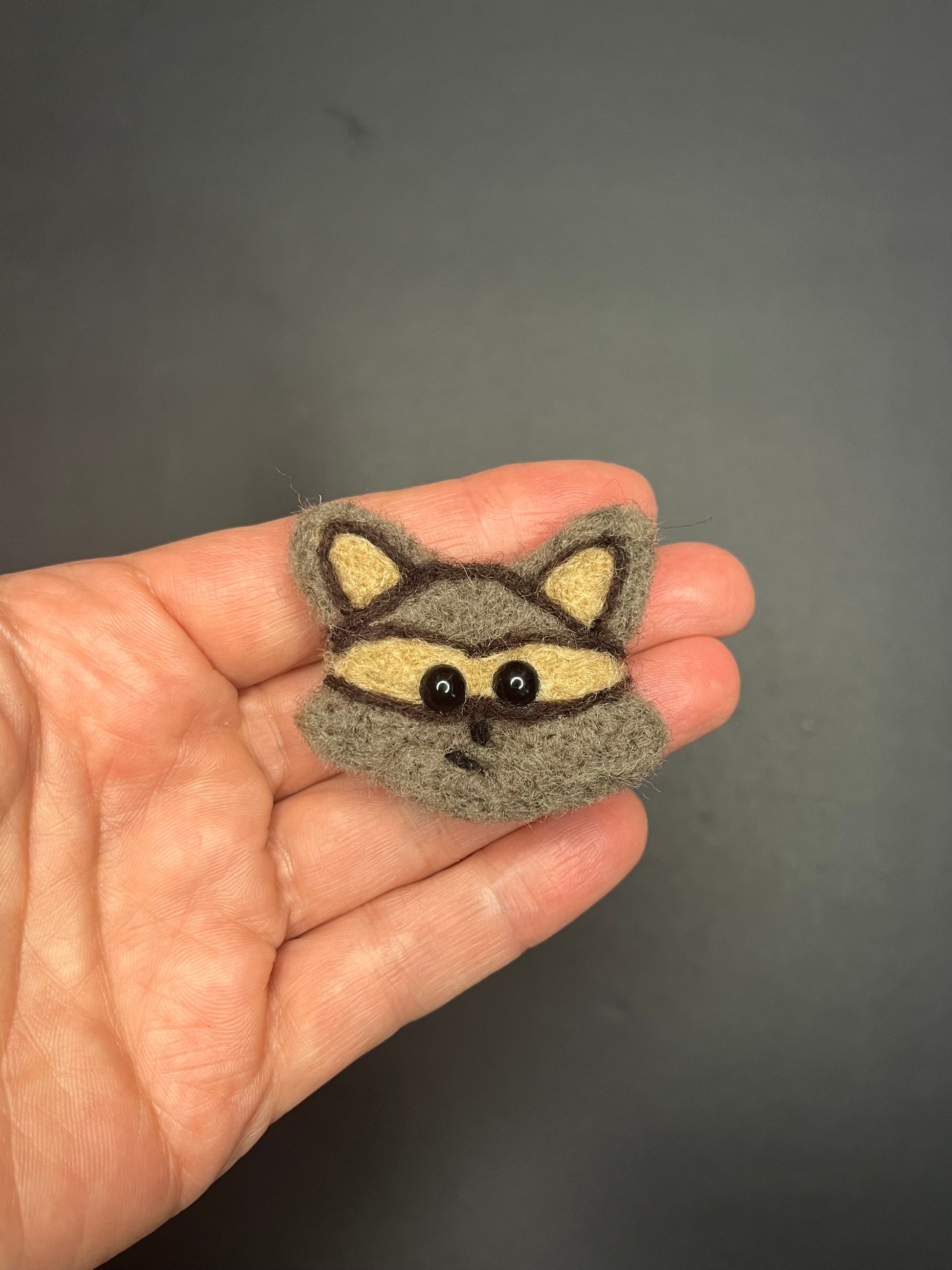 Adorable needle felted raccoon pin